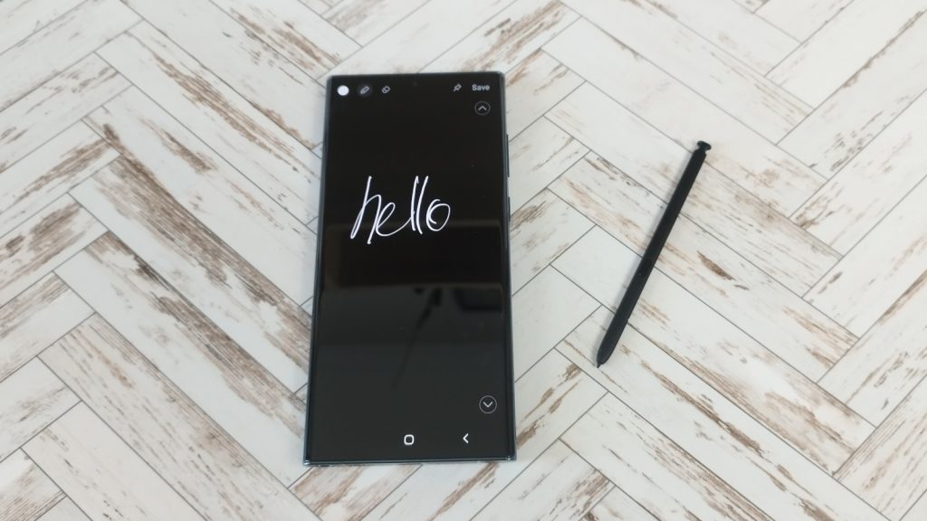 s pen next to phone